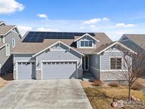 Attractive home featuring a three car garage and solar panels at 464 Wagon Bend Rd, Berthoud, CO 80513