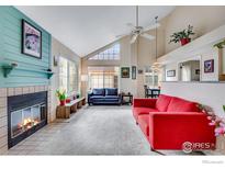 Bright living room with fireplace, vaulted ceiling, and plenty of natural light at 4881 White Rock Cir # F, Boulder, CO 80301