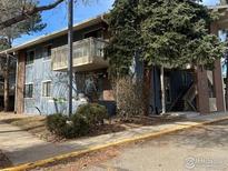 Multi-Gathering property with an upper deck, mature landscaping, and a brick facade at 2800 Kalmia Ave # 320, Boulder, CO 80301