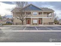 Charming two-story townhouse with stone accents and reserved parking in a well-kept community at 3575 Boulder Cir # 101, Broomfield, CO 80023