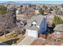 Charming two-story home featuring a spacious two-car garage and well-maintained landscaping at 7089 W Polk Pl, Littleton, CO 80123