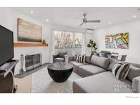Bright living room boasts a fireplace, modern decor, and a comfortable sectional sofa at 2444 9Th St # 4, Boulder, CO 80304