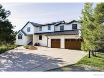Beautiful two-story home featuring a spacious driveway, two car garage, and mature landscaping at 4932 Valkyrie Dr, Boulder, CO 80301