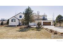 Charming two-story home boasts a modern design with well-manicured front yard and attached two car garage at 4932 Valkyrie Dr, Boulder, CO 80301