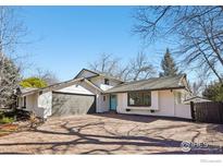 Charming home featuring a brick driveway and a light blue front door at 7288 Petursdale Ct, Boulder, CO 80301