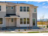 Charming two-story townhome with modern facade and landscaped front yard at 1779 Mount Meeker Ave, Berthoud, CO 80513