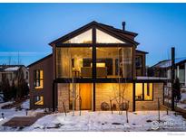 Stunning modern home featuring a unique window design and a mix of wood and stone exterior elements at 2586 3Rd St, Boulder, CO 80304