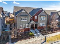 Charming two-story home with a landscaped front yard and colorful exterior at 8146 E 53Rd Dr, Denver, CO 80238