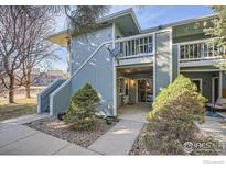 Inviting condo exterior featuring well-maintained landscaping and charming unit entrances at 1057 Delta Dr # A, Lafayette, CO 80026