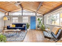 Inviting living room with a vaulted ceiling, modern furnishings, and natural light at 1105 Hartford Dr, Boulder, CO 80305