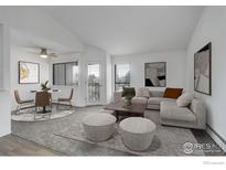 Bright living room featuring neutral decor, a dining area, and large windows at 3525 28Th St # 304, Boulder, CO 80301