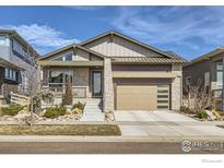 Charming home featuring modern architecture and a well-manicured front yard at 5626 Four Leaf Dr, Longmont, CO 80503