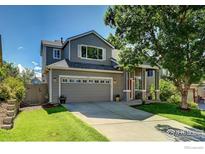 Charming two-story home featuring a well-maintained front yard and a spacious two-car garage at 3727 Castle Peak Ave, Superior, CO 80027
