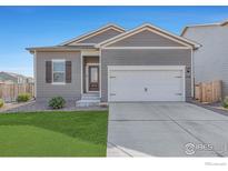 Charming single-story home featuring a well-kept lawn, two car garage, and neutral-toned siding under a bright blue sky at 1152 Payton Ave, Fort Lupton, CO 80621