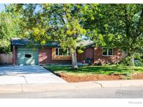 Charming brick ranch home with mature trees and well-maintained landscaping at 3335 Darley Ave, Boulder, CO 80305