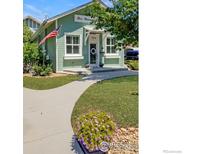 Charming home featuring a well-manicured lawn and a welcoming front entrance with clean curb appeal at 954 11Th Ave, Longmont, CO 80501