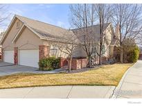 Charming single-Gathering home featuring a two-car garage and well-maintained front yard at 1333 Charles Dr # 15, Longmont, CO 80503