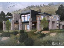 Modern luxury home showcasing stone accents and a sleek design against a scenic mountain backdrop at 3645 Cholla Ct, Boulder, CO 80304