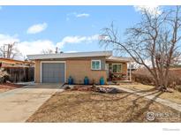 Charming brick single-story home with a well-maintained front yard and an attached one car garage at 6190 Estes Ct, Arvada, CO 80004