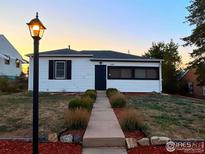 Charming single story home with sidewalk and landscaping at 150 S Canosa Ct, Denver, CO 80219