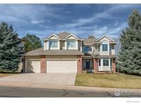 Charming two-story home with a three-car garage and well-maintained front yard at 1919 Breen Ln, Superior, CO 80027