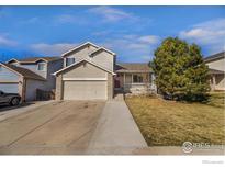 Charming two-story home with a well-maintained lawn and attached two-car garage at 465 S 24Th Ave, Brighton, CO 80601