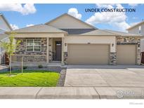 Charming single Gathering home featuring a three car garage and a welcoming front porch at 4723 Windmill Dr, Brighton, CO 80601