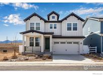 Inviting two-story home featuring a modern farmhouse design, landscaping, and a two-car garage at 153 Mohawk Cir, Superior, CO 80027