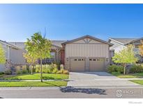 Charming ranch-style home with a two-car garage, landscaped front yard, and inviting curb appeal at 22646 E Glidden Dr, Aurora, CO 80016