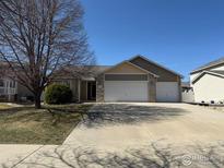 Charming single-Gathering home featuring a three-car garage and well-maintained front yard at 301 7Th St, Mead, CO 80542