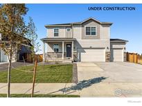 Charming two-story home featuring a welcoming front porch and a spacious three-car garage at 4115 Marble Dr, Mead, CO 80504