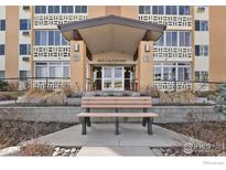 Inviting entryway with bench seating to the condo building at 665 S Alton Way at 665 S Alton Way # 12A, Denver, CO 80247