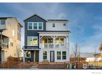 Charming two-story home featuring a modern exterior and inviting front porch at 841 Hearteye Trl, Lafayette, CO 80026