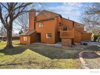 Charming two-story home featuring a spacious yard, wooden deck, and inviting entryway at 2275 E 129Th Ave, Thornton, CO 80241