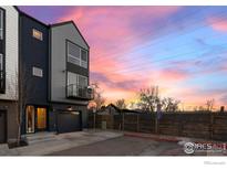 Modern townhome with gray siding and beautiful sunset sky at 5678 W 10Th Pl, Lakewood, CO 80214