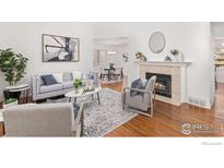 Cozy living room featuring a fireplace, modern furniture, and an open floor plan at 2471 Norwood Ave, Boulder, CO 80304