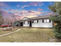 Charming single Gathering home showcasing a well-maintained yard and classic white siding at 3090 Euclid Ave, Boulder, CO 80303