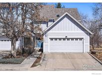 Charming two-story home featuring a two-car garage and a well-maintained front yard in a friendly neighborhood at 2201 Watersong Cir, Longmont, CO 80504