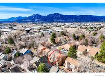 Scenic aerial shot showcases neighborhood, with stunning mountain views and tree-lined streets at 3076 Fulton Cir, Boulder, CO 80301