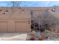Charming townhome featuring an attached garage and well-maintained landscaping at 3076 Fulton Cir, Boulder, CO 80301