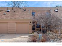 Inviting townhome featuring a one-car garage and a covered front entry at 3076 Fulton Cir, Boulder, CO 80301