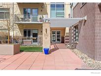 Inviting entrance to the building with well maintained landscaping and hardscape at 3401 Arapahoe Ave # 406, Boulder, CO 80303