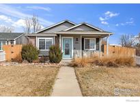 Charming single-Gathering home featuring manicured landscaping, a welcoming porch, and a light gray exterior at 355 8Th St, Frederick, CO 80530