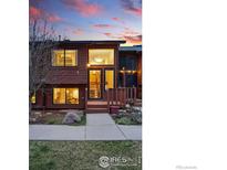 Inviting two-story townhome with mature landscaping and a cozy front porch entrance at 2687 Juniper Ave # 63, Boulder, CO 80304
