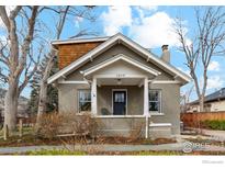 Charming home featuring a covered front porch and neat landscaping for a welcoming curb appeal at 1013 Mapleton Ave, Boulder, CO 80304