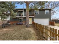 Charming home featuring balconies, a swing, and a well-manicured front yard perfect for outdoor relaxation at 1402 Athene Dr, Lafayette, CO 80026