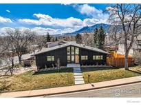 Striking modern home with mountain views, clean lines, and professional landscaping at 1580 Moss Rock Pl, Boulder, CO 80304