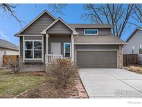 Charming home with a two-car garage and inviting front porch at 180 N Holcomb St, Castle Rock, CO 80104