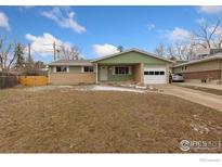 Charming single-story home with a well-maintained front yard and attached garage in a quiet neighborhood at 4480 Hastings Dr, Boulder, CO 80305