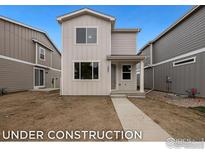 Charming, modern two-story home with neutral siding and a welcoming front porch at 1051 Spartan Ave, Berthoud, CO 80513